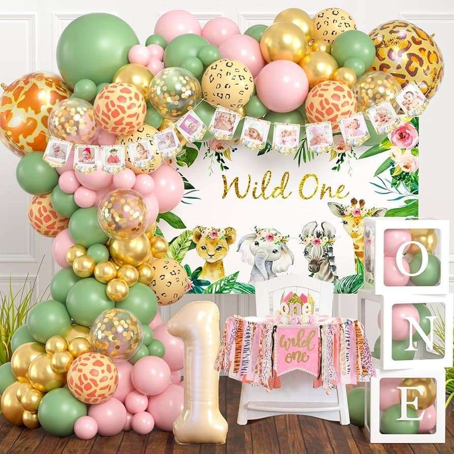 Best First and Second Birthday Party Ideas for Boys and Girls 59 Wild One birthday party setup with pastel balloons, baby jungle animals, and floral decorations for girls