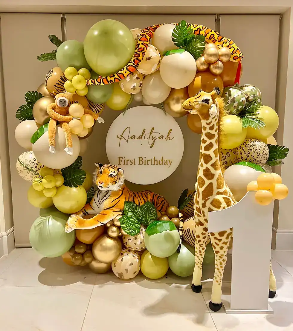 Wild One balloon garland in sage, ivory and sand framing the welcome sign