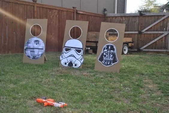 Teens enjoying Star Wars party games, trivia, and video game lounge