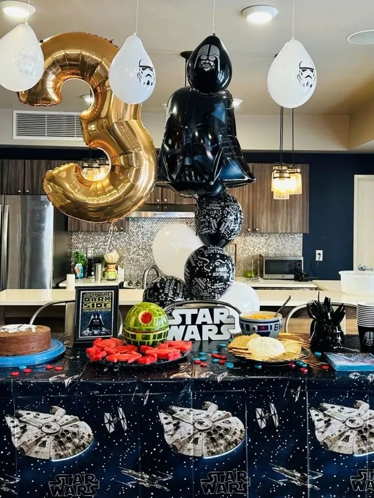 Colorful Star Wars birthday decorations for toddlers with balloons and character details