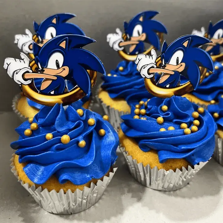 Cupcakes with blue icing and edible golden rings